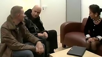 A Mature German Woman With Unshaven Skin Engages In Sexual Activity With Two Men
