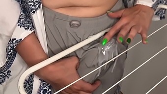 Stepson Watches As Stepmother'S Huge Breasts Rub Against Clothes Dryer In Homemade Video